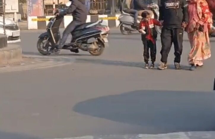 Pedestrians trying to cross road in Hazratganj , Lucknow