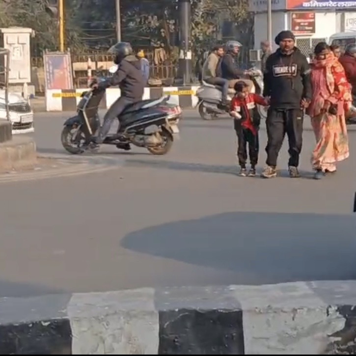 Pedestrians trying to cross road in Hazratganj , Lucknow