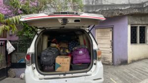 Dr Viranchi Acharya ready to move with his luggage loaded in car 